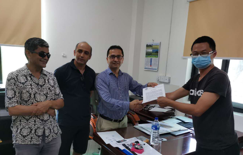 Manager of the project presents the certificate.